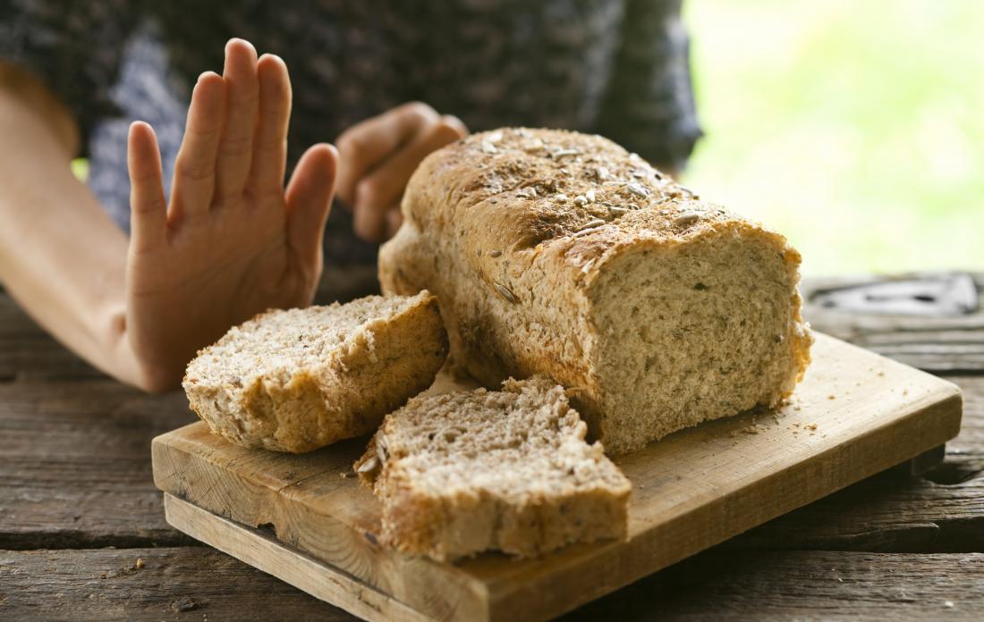 person refusing bread because of celiac disease.