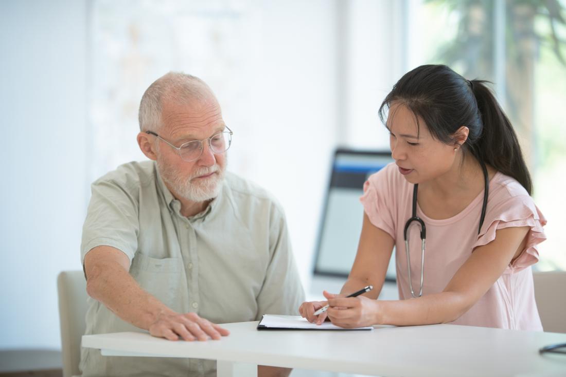 doctor with patient explaining cardiovascular disease