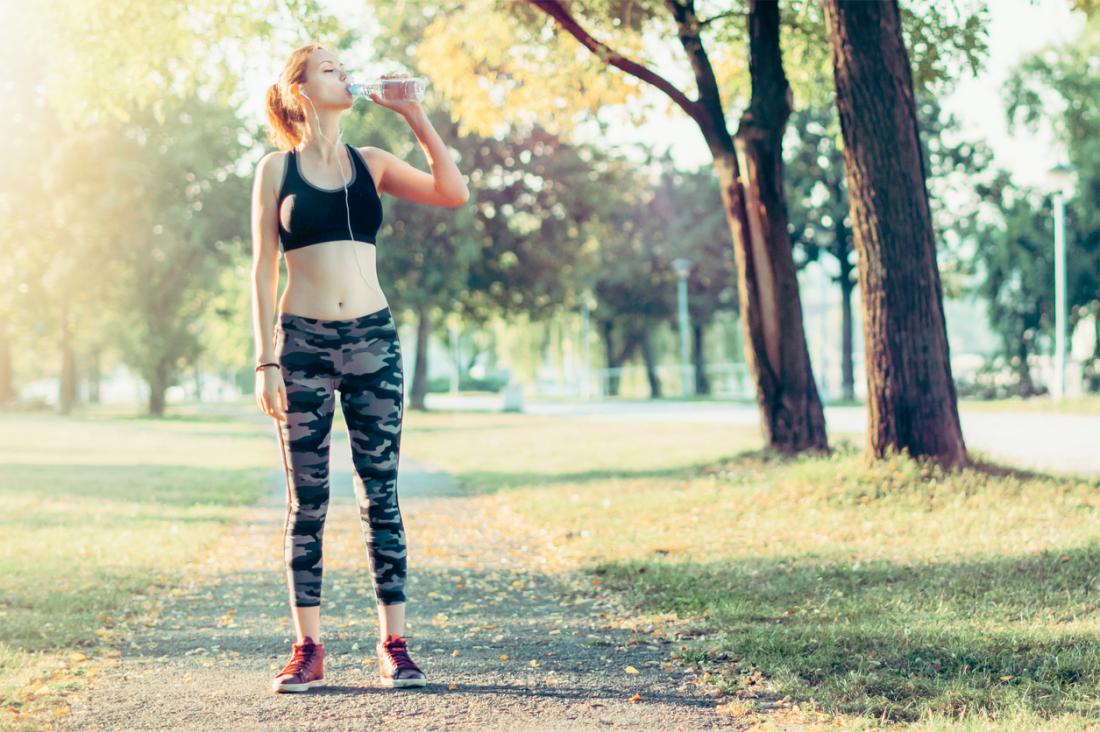 Woman drinks sports drink