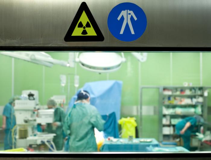 Radiology suite with warning signs.