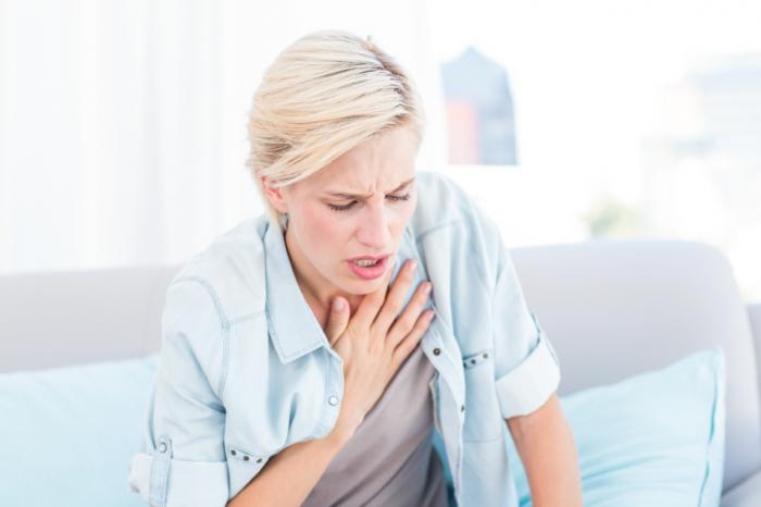 a woman having difficulty breathing