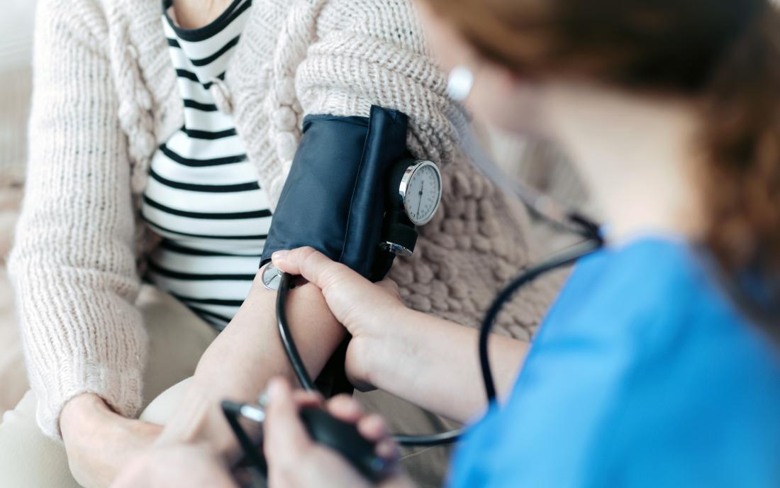 a woman having a blood pressure test. 