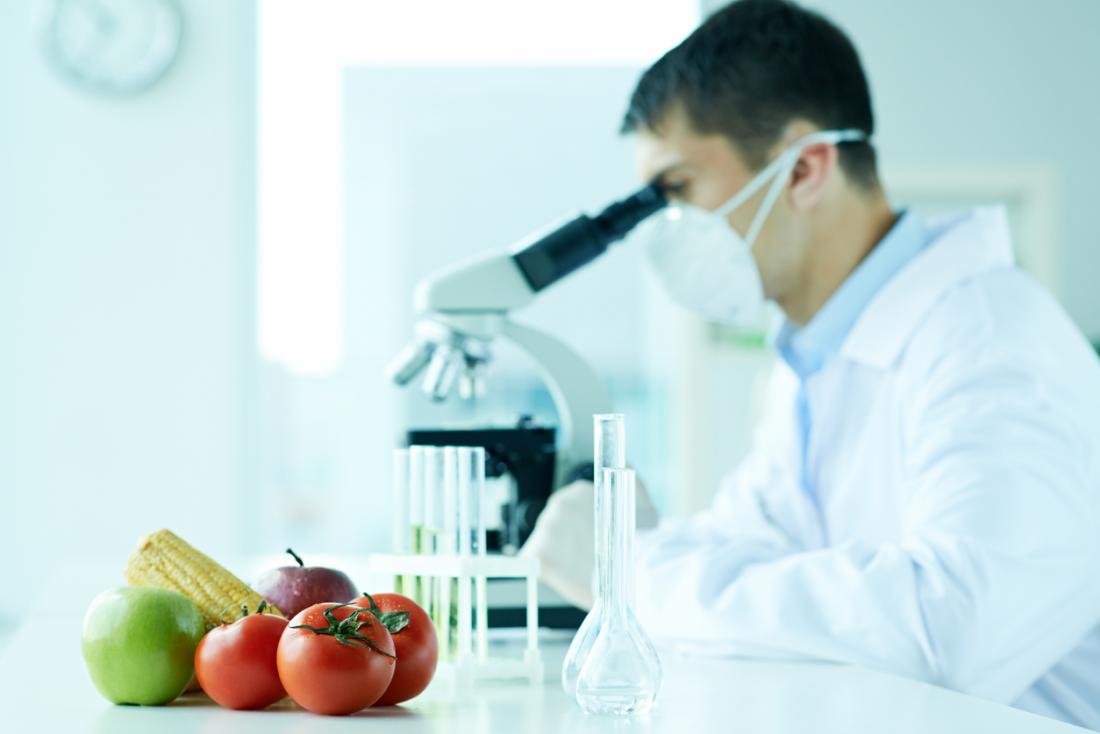 Food scientist doing research with microscope