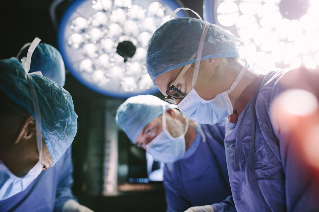 Surgeons working on a patient