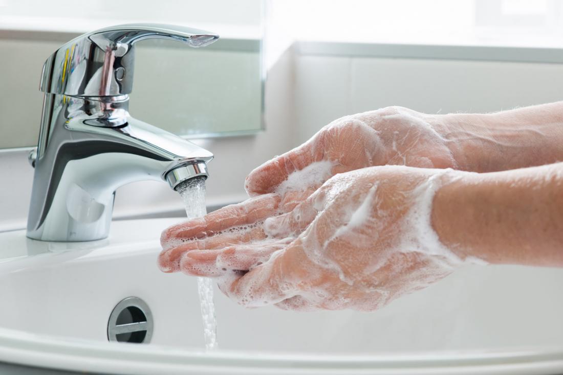 Someone washing their hands in a sink