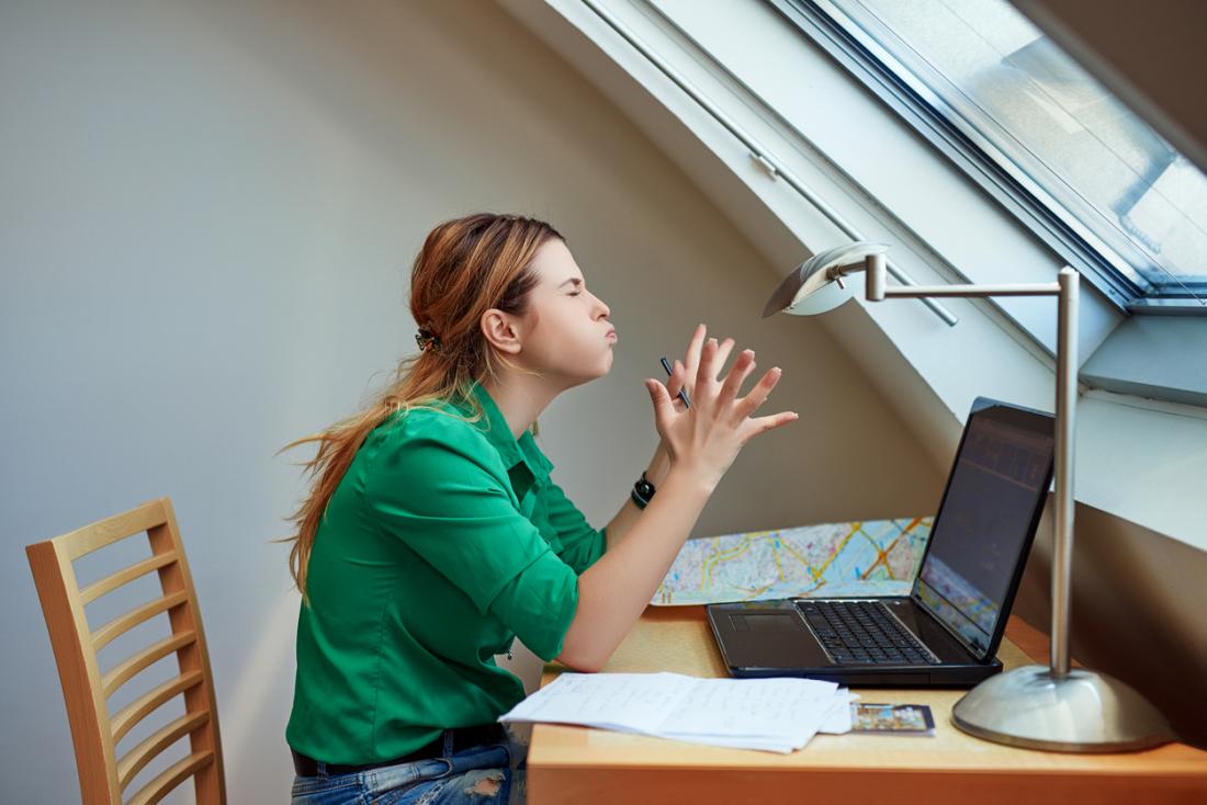 woman annoyed at her desk