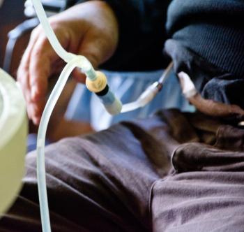 A man undergoing peritoneal dialysis treatment.