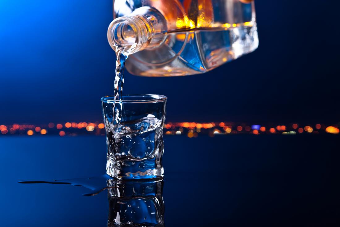 pouring a glass of vodka