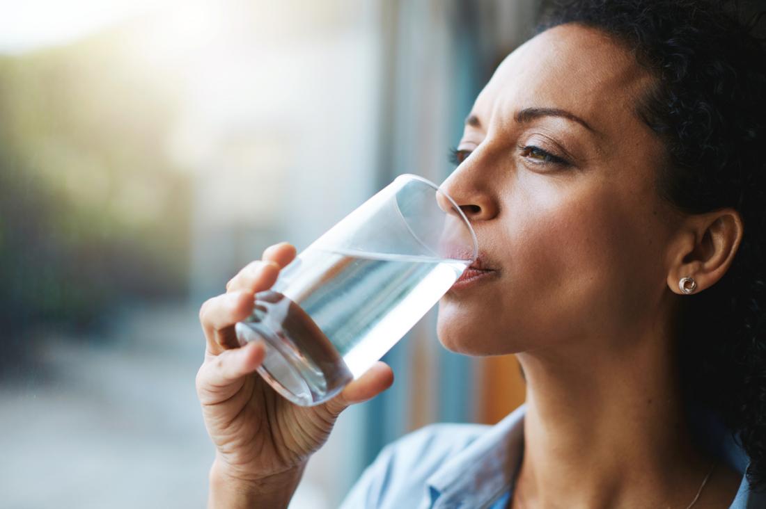 woman stays hydrated<!--mce:protected %0A-->