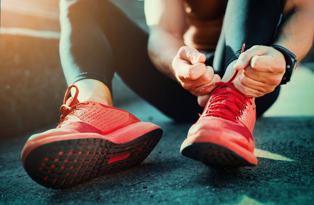 Woman in exercise gear ready to go jogging.