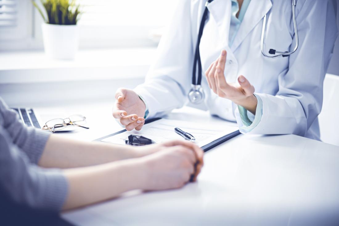 Doctor explaining water retention to patient.