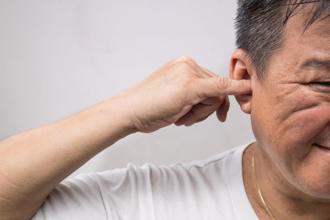 impacted ear wax dizziness