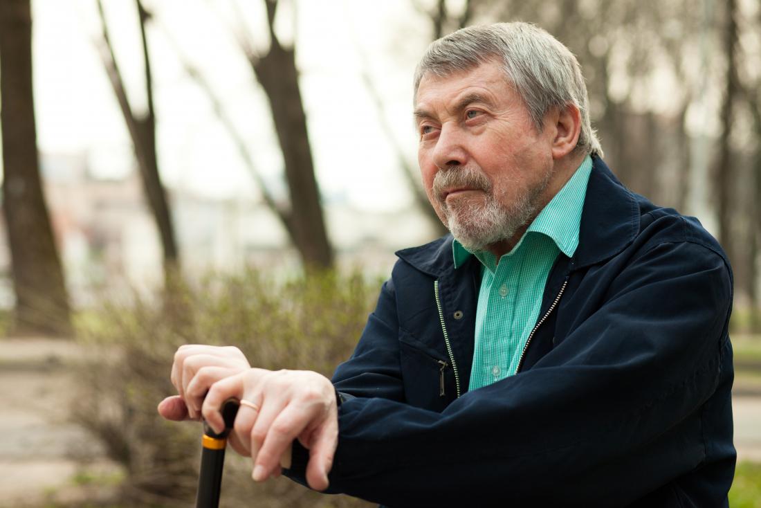 man sits on bench looking stern