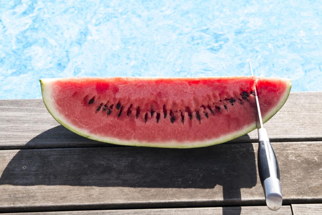 slice of watermelon with a knife 