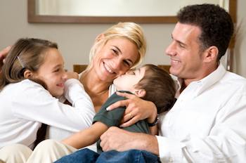 A happy family hugging each other