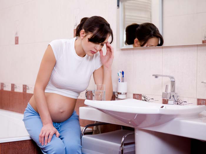 Woman experiencing morning sickness
