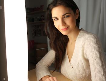 Lady sitting in front of a light box