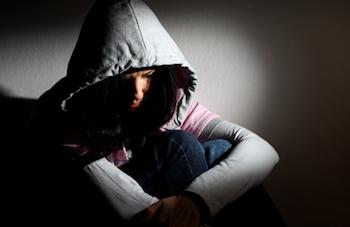 Dark picture of girl suffering from seasonal affective disorder