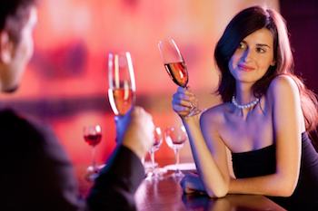 Couple drinking champagne in a bar