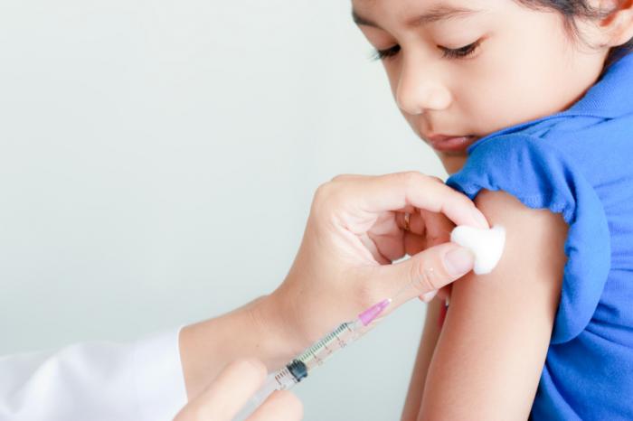child receiving a vaccine