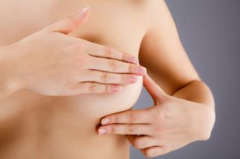 Woman checking breast
