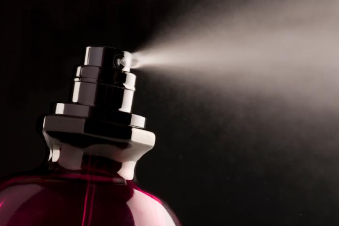 spraying perfume