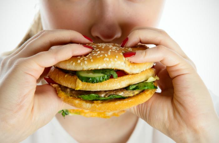 woman eating burger