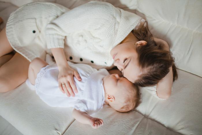 infant sleeping on sofa