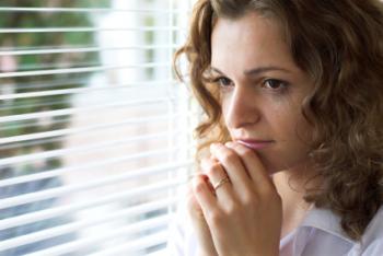 Sad woman looking out the window