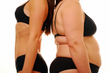 Two women standing back-to-back