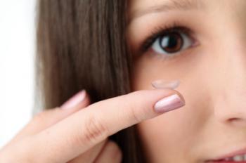 Woman using contact lens