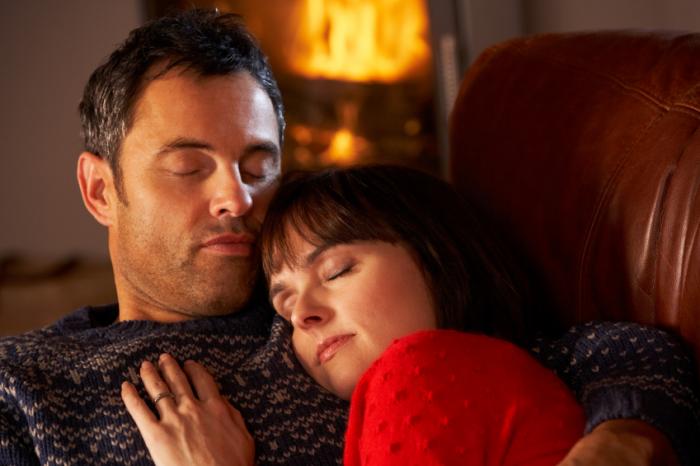 couple sleeping on couch