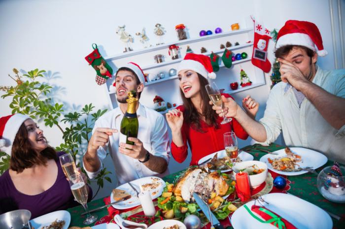 A group of people having a Christmas meal
