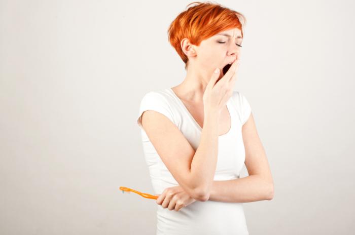 woman yawning in the morning