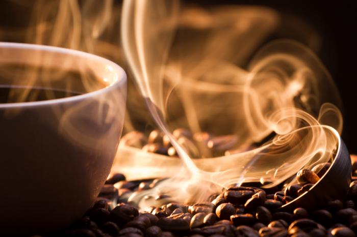 A cup of coffee and coffee beans