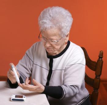 older lady checking blood sugar level