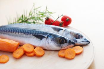 Fish on a plate with some vegetables