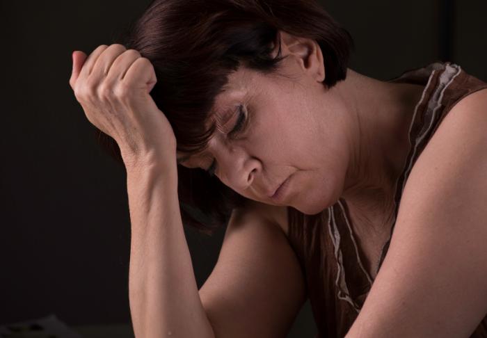 A stressed middle-aged woman