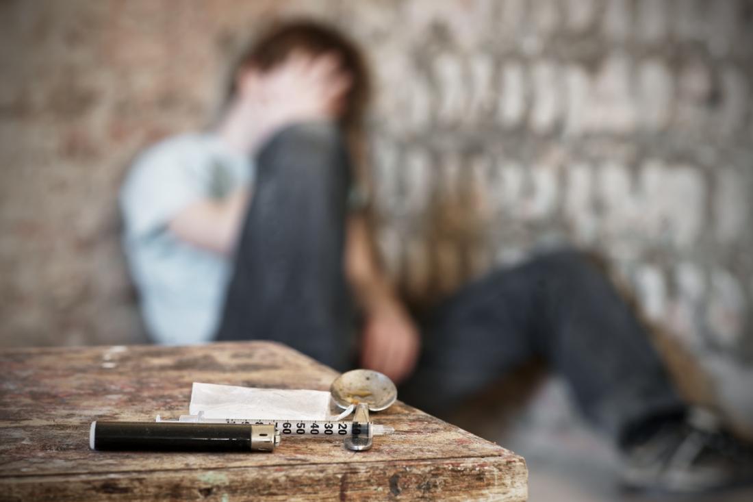 Blurry man after injecting drugs