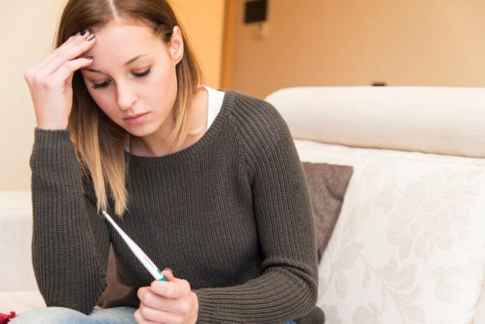 Woman holding pregnancy test