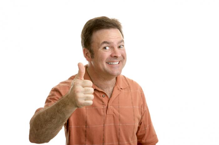 Happy man giving the thumb up signal.
