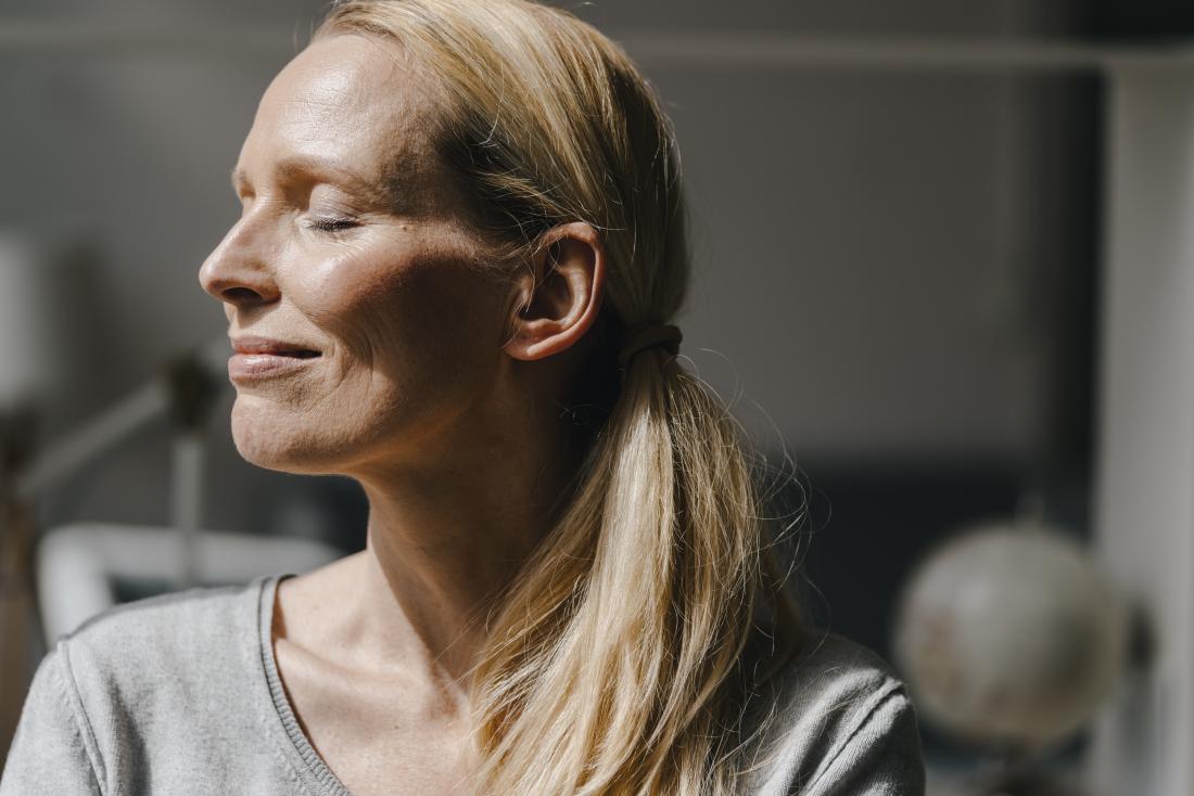 woman smiling in sunshine