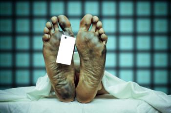 Feet of a corpse with tag attached.