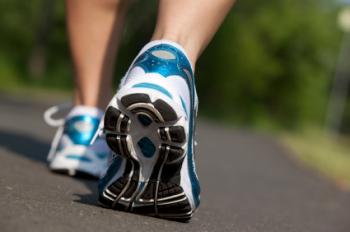 back view of person with trainers walking