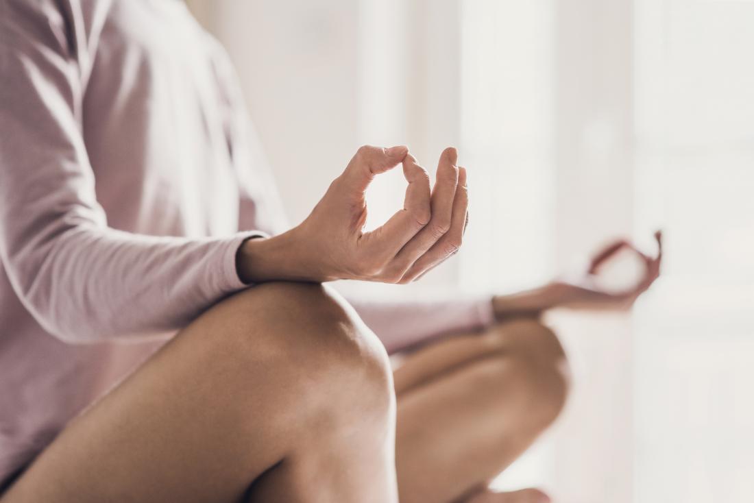 Person meditating.