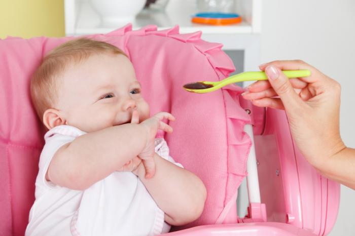 [baby feeding with spoon