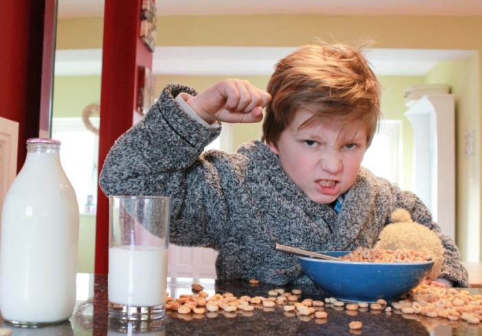 Child with ADHD eating breakfast