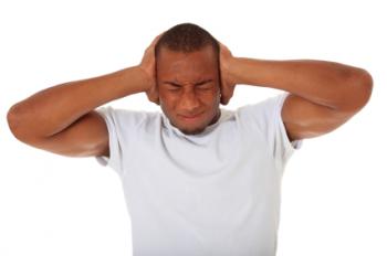 stressed man holding head