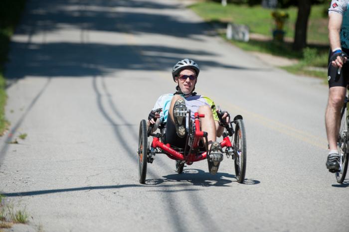 A person using a recumbent bicycle.