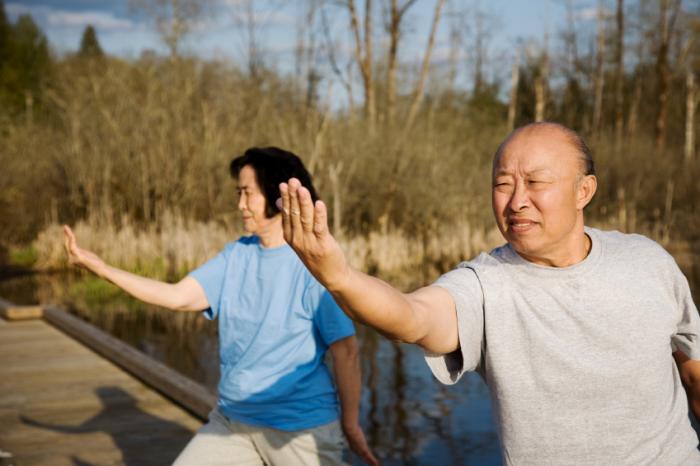 Older adults doing tai chi.